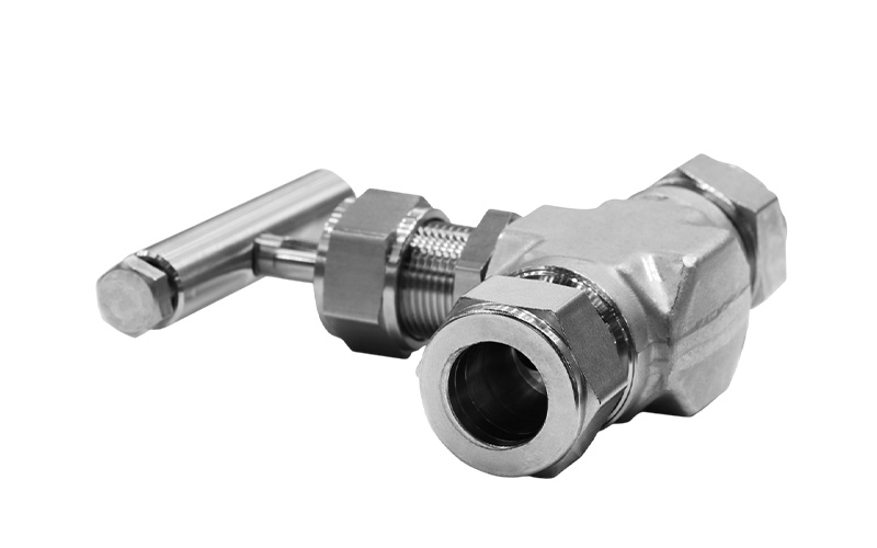 A close-up shot of an industrial silver needle valve with a T-handle against a plain white background