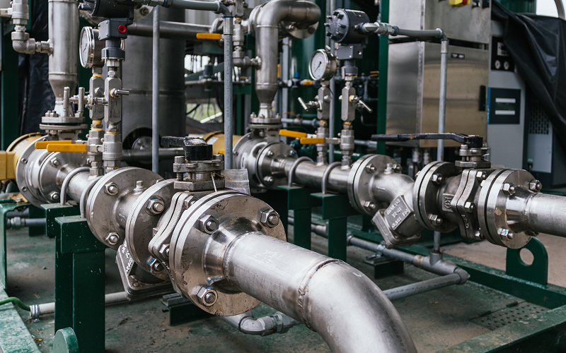 Stainless steel industrial piping and valve system for processing.